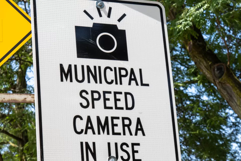 "Municipal speed camera in use" sign